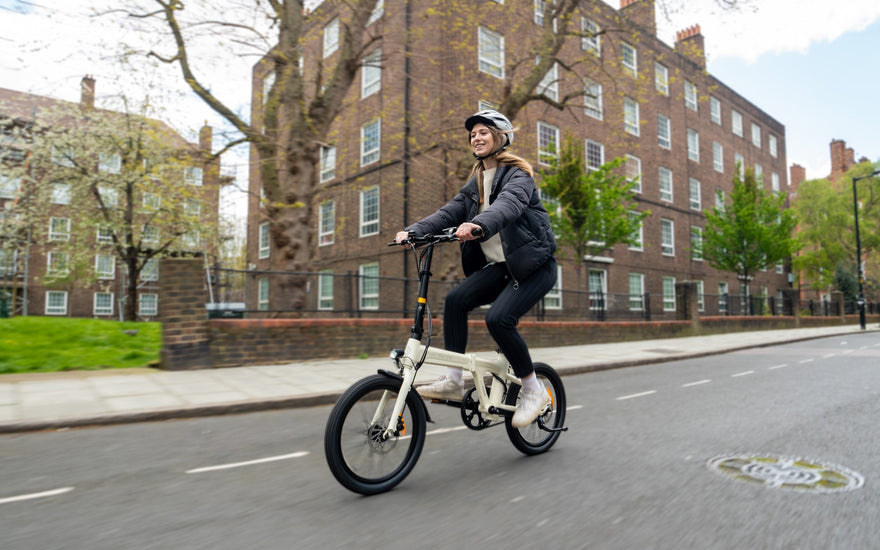 ADO folding e-bike used for eco-friendly commuting in a UK urban environment