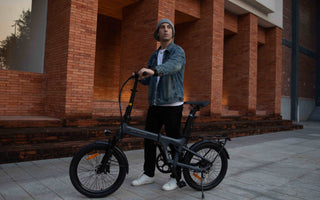 E-bike rider navigating mixed London city terrain with traffic, flat roads, and uneven urban surfaces.
