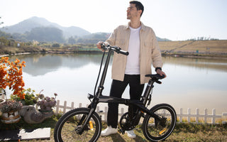 Cyclists riding e-bikes through UK countryside, coastal routes and urban cycling paths.