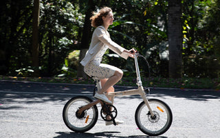 E-bikes on a city street, illustrating how to commute with electric bicycle UK for a greener journey.