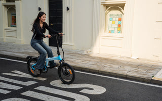 ADO Air 20 Ultra electric bike with three-speed motor riding on urban streets in the UK.